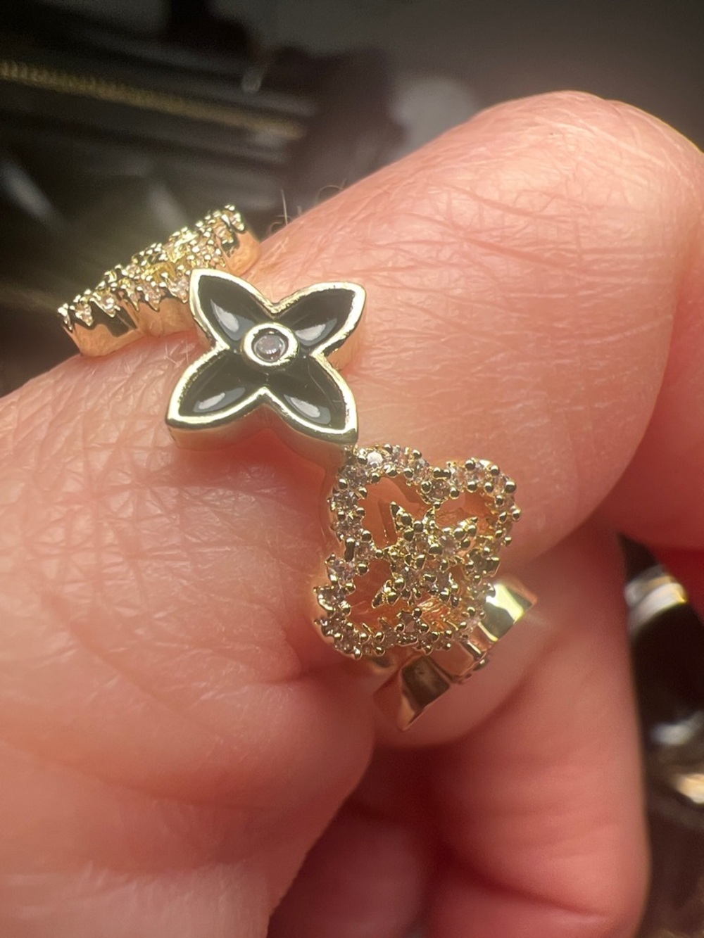Gold Tone Open Ring with Black Enamel Flower Accent